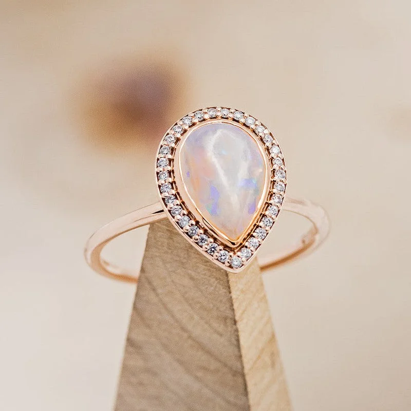 "TERRA" - PEAR CABOCHON CUT OPAL ENGAGEMENT RING WITH DIAMOND HALO